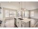 This modern kitchen features white cabinets, stainless steel appliances, and a large island at 1807 Grayside Cir, Castle Rock, CO 80109