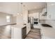 This modern kitchen features white cabinets, stainless steel appliances, and a large island at 1807 Grayside Cir, Castle Rock, CO 80109