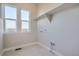 Laundry room with tile flooring, windows with natural light, and washer and dryer hookups at 1807 Grayside Cir, Castle Rock, CO 80109