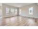 Open-concept living space featuring wood floors, neutral paint, and natural light and mountain views at 1807 Grayside Cir, Castle Rock, CO 80109