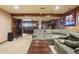 Spacious basement with bar and seating area at 9042 E Wagon Wheel Way, Parker, CO 80138