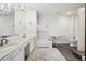 Spacious bathroom featuring a double vanity, soaking tub, and separate shower at 9042 E Wagon Wheel Way, Parker, CO 80138