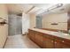 Bathroom with double vanity and shower at 9042 E Wagon Wheel Way, Parker, CO 80138