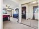 Main bedroom with mirrored closet doors and carpet at 9042 E Wagon Wheel Way, Parker, CO 80138