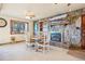 Stone fireplace is a focal point in this dining area at 9042 E Wagon Wheel Way, Parker, CO 80138