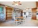 Cozy dining area with stone fireplace and built-in shelving at 9042 E Wagon Wheel Way, Parker, CO 80138