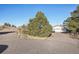 Driveway leading to a house with a two-car garage at 9042 E Wagon Wheel Way, Parker, CO 80138