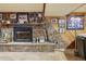 Stone fireplace with sports memorabilia at 9042 E Wagon Wheel Way, Parker, CO 80138