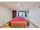 Basement game room features a pool table and window at 9042 E Wagon Wheel Way, Parker, CO 80138