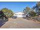 Two-car garage with ample driveway space at 9042 E Wagon Wheel Way, Parker, CO 80138