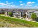 Aerial view of homes with landscaping, sidewalks, and a wooden fence at 17548 Bluetrail Ave, Parker, CO 80134