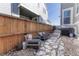 Cozy backyard with stone pavers, gravel, privacy fence, and grill, perfect for outdoor gatherings at 17548 Bluetrail Ave, Parker, CO 80134
