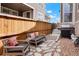 Cozy backyard seating area with stone pathway and a grill at 17548 Bluetrail Ave, Parker, CO 80134