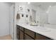 Bathroom with double sinks, a large mirror, and a walk-in shower at 17548 Bluetrail Ave, Parker, CO 80134