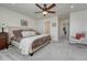 Spacious bedroom featuring plush carpet, a ceiling fan, and comfortable neutral decor at 17548 Bluetrail Ave, Parker, CO 80134