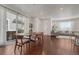 Elegant dining area with hardwood floors, natural light, and stylish furnishings, perfect for Gathering meals and gatherings at 17548 Bluetrail Ave, Parker, CO 80134