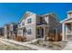 Well-maintained home with tidy landscaping, muted colors, and a welcoming entrance, nestled within a charming neighborhood at 17548 Bluetrail Ave, Parker, CO 80134