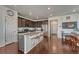 Modern kitchen boasts stainless steel appliances, granite countertops, and a large island with bar seating at 17548 Bluetrail Ave, Parker, CO 80134