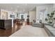 Open-concept living area features hardwood floors, neutral walls, and lots of natural light; excellent for entertaining at 17548 Bluetrail Ave, Parker, CO 80134