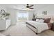 Bright main bedroom with plush carpet, a large window, and neutral tones at 17548 Bluetrail Ave, Parker, CO 80134