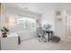 Bright office space with a window, desk, chair, and white walls at 17548 Bluetrail Ave, Parker, CO 80134