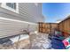 Private patio area with stone pavers, gravel, and cozy seating for outdoor relaxation at 17548 Bluetrail Ave, Parker, CO 80134