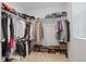 Organized walk-in closet with ample shelving, hanging space, and shoe storage at 17548 Bluetrail Ave, Parker, CO 80134