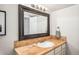 Bathroom with updated vanity and large mirror at 5123 Bryant St, Denver, CO 80221