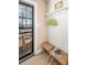 Entryway with two wicker stools and coat rack at 5123 Bryant St, Denver, CO 80221