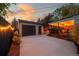 Detached garage and covered patio with string lights at 5123 Bryant St, Denver, CO 80221