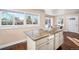 Kitchen island with granite countertop and hardwood floor at 5123 Bryant St, Denver, CO 80221