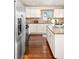 Modern kitchen with stainless steel appliances and hardwood floor at 5123 Bryant St, Denver, CO 80221