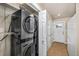 Laundry room with LG washer and dryer, and storage shelves at 5123 Bryant St, Denver, CO 80221