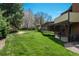 Beautiful backyard featuring a large lawn and mature trees at 5361 Nassau Cir, Cherry Hills Village, CO 80113