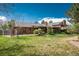 The backyard has a spacious lawn and brick patio at 5361 Nassau Cir, Cherry Hills Village, CO 80113