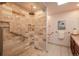 Walk-in shower with elegant tilework, and grab bars for accessibility in the bathroom at 5361 Nassau Cir, Cherry Hills Village, CO 80113