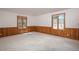 Bright bedroom with paneled accent walls, neutral carpet, and large windows providing natural light at 5361 Nassau Cir, Cherry Hills Village, CO 80113
