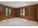 The living room has wood paneling, carpet and a large double window at 5361 Nassau Cir, Cherry Hills Village, CO 80113