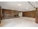 Inviting living room boasts a stone fireplace, wood-paneled walls, carpet floors and natural light at 5361 Nassau Cir, Cherry Hills Village, CO 80113