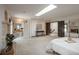 Bedroom with a fireplace, skylight, and ensuite bathroom at 5361 Nassau Cir, Cherry Hills Village, CO 80113