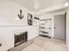 Versatile basement area with a fireplace, providing potential for customization and additional living space at 1956 Cathay St, Aurora, CO 80011