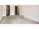 Large bedroom area showcasing neutral carpet, white walls, and a large closet with organizers at 1956 Cathay St, Aurora, CO 80011