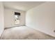 Bright bedroom with neutral carpet and window, offering a simple and clean space at 1956 Cathay St, Aurora, CO 80011