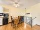 Cozy dining area features stylish light fixture, hardwood floors, and kitchen access at 1956 Cathay St, Aurora, CO 80011