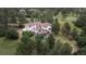 Aerial view of a house surrounded by mature trees and greenery offering great privacy at 7641 Kelty Trl, Franktown, CO 80116
