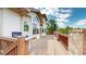 Wide wooden deck with built-in grill offers ample space for outdoor entertaining at 7641 Kelty Trl, Franktown, CO 80116
