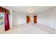 Spacious bedroom with carpet and a door to another room at 7641 Kelty Trl, Franktown, CO 80116
