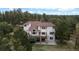 Aerial view of home surrounded by trees, showcasing the back deck at 7641 Kelty Trl, Franktown, CO 80116