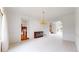 Bright living room with white carpet and crown molding, featuring a chandelier at 7641 Kelty Trl, Franktown, CO 80116