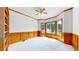 Bright office featuring built in shelves, wood trim, and a ceiling fan at 7641 Kelty Trl, Franktown, CO 80116